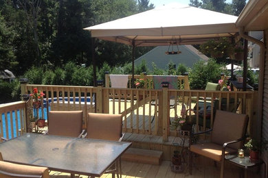 Example of a beach style deck design in Boston