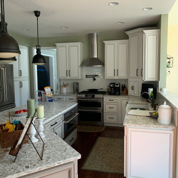 cabinet refacing ant white with brown glaze--quartz and new backsplash