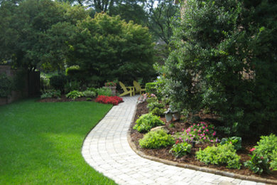 Inspiration for a backyard brick garden path in Louisville.