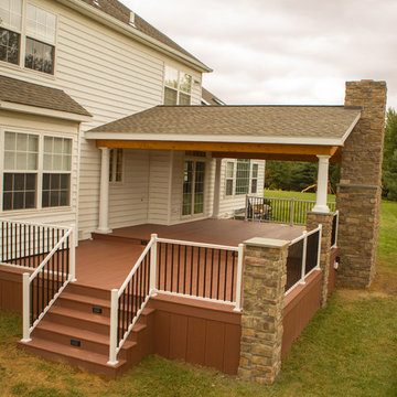 Two tier deck with stone fireplace
