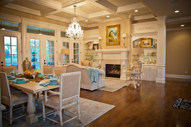 Family room - large traditional enclosed dark wood floor family room idea in Nashville with yellow walls, a standard fireplace and a tile fireplace