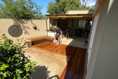 Design ideas for a large contemporary backyard and ground level deck in Melbourne with an outdoor kitchen and no cover.