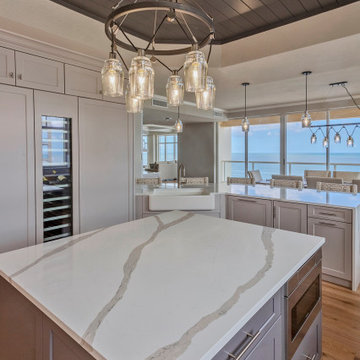 Modern Coastal Kitchen with Sleek White Cabinets and Ocean Views
