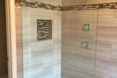 Inspiration for a porcelain tile porcelain tile and brown floor bathroom remodel in Dallas with medium tone wood cabinets, a one-piece toilet, beige walls, an undermount sink and quartz countertops