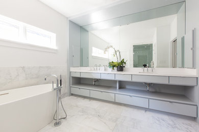 Example of a large transitional master gray tile, white tile and stone tile marble floor bathroom design in Dallas with flat-panel cabinets, gray cabinets, white walls, an undermount sink and quartz countertops