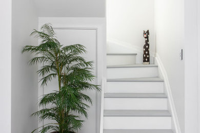 Inspiration for a mid-sized beach style curved staircase in Sunshine Coast.