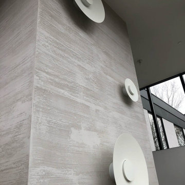 Horizontal lime plaster application on elevator walls