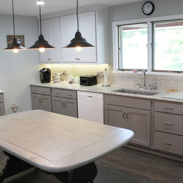 White Upper Cabinet and Gray Base Cabinet Kitchen With Quartz Counters