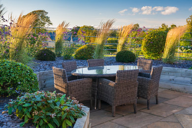 Traditional patio in Other with tiled flooring and no cover.