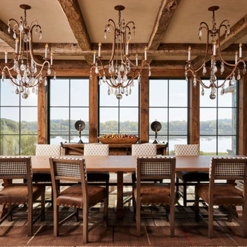 Hand Hewn Timbers and Antique Skip Oak Flooring in Elegant Farmhouse Dining Room