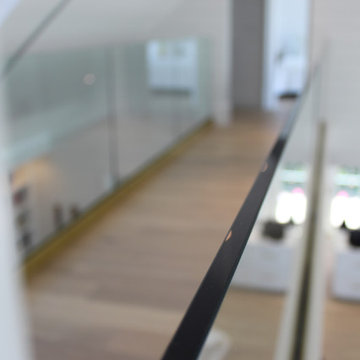 Glass Balustrade with Aluminum Base Rail Finished with Satin Brass Cladding