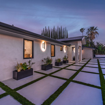 Front Elevation Washed by Sconce Light at Twilight