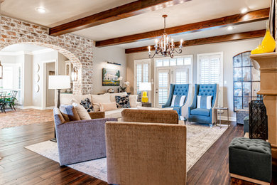 Living room - mid-sized transitional open concept dark wood floor and brown floor living room idea in Little Rock with beige walls, a standard fireplace and a plaster fireplace