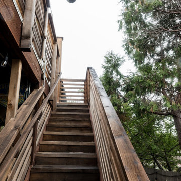 Custom second story Deck - Tile, Redwood & Glass