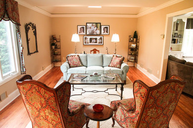 Inspiration for a mid-sized timeless formal and enclosed dark wood floor and brown floor living room remodel in Newark with beige walls, no fireplace and no tv