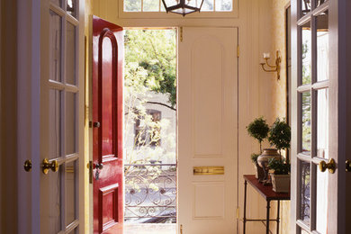 Entryway - small traditional marble floor entryway idea in DC Metro with beige walls