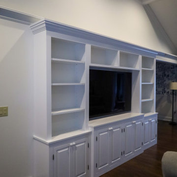 Statement-Making Living Room: Custom White Built-In Entertainment Center with Op
