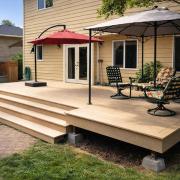 Composite Backyard Deck with Wide Wraparound Steps in Rochester, WA