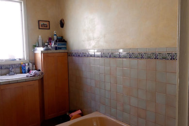 Inspiration for a contemporary ceramic tile ceramic tile bathroom remodel in San Francisco with a two-piece toilet, a drop-in sink and tile countertops