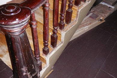 Example of a large ornate wooden curved staircase design in Other with wooden risers