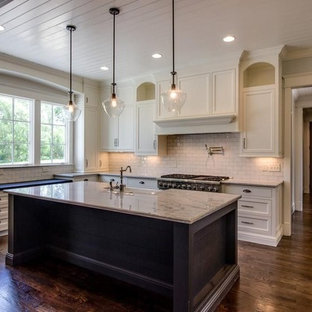 Large traditional kitchen pantry designs - Large elegant l-shaped kitchen pantry photo in Nashville with shaker cabinets and an island