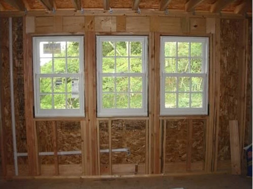 sconces in kitchen in between windows over sink