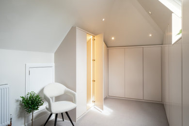 Design ideas for a contemporary wardrobe in Surrey.