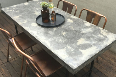 1.8m two tone polished concrete dining table with industrial pipe.
