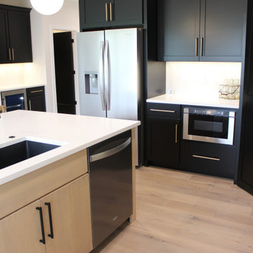 Black and Maple Wheat Kitchen with Brass Banded Hood