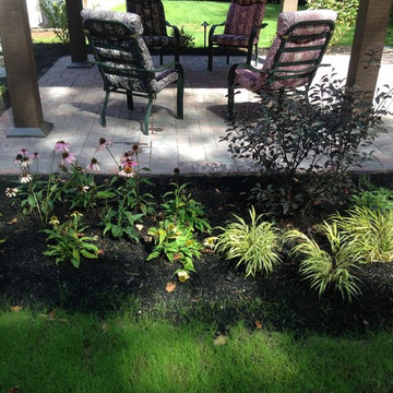 Gazebo and outdoor fireplace with sitting wall and small fountian