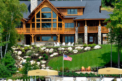 Example of a large mountain style brown three-story mixed siding exterior home design in Other with a shingle roof