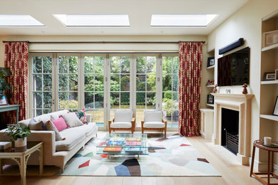 Example of a transitional living room design in London
