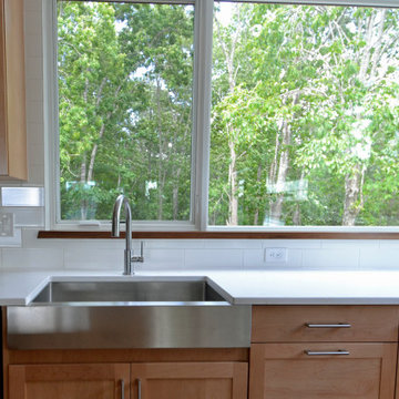 Mountain ModernContemporary style apron front sink is a central feature in the k
