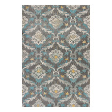 area rug in front of fireplace