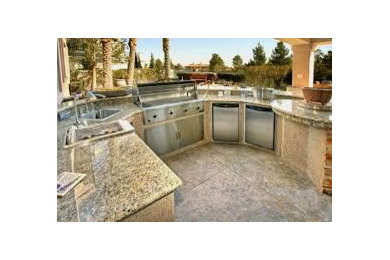 Patio kitchen - rustic backyard brick patio kitchen idea in Houston with a roof extension