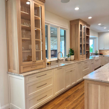 Frameless white perimeter with rift cut oak islands