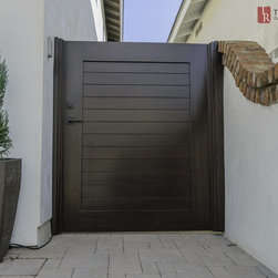 Mediterranean Garage Doors with Matching Entry Gates - Home Fencing And Gates