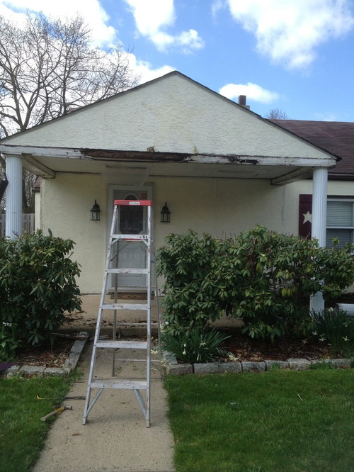 Entry door offcentered to porch roof pitch