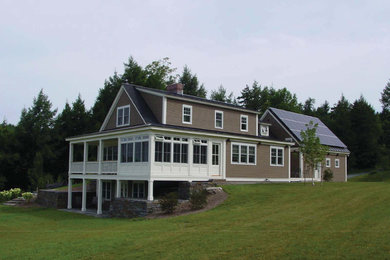 Mid-sized cottage beige two-story exterior home photo in Burlington