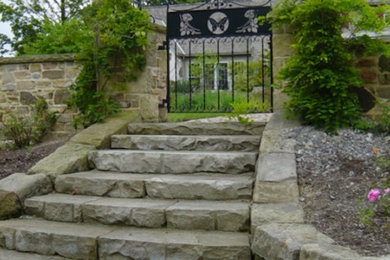 Design ideas for a large courtyard stone landscaping in Cleveland.