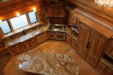 Eat-in kitchen - large craftsman l-shaped travertine floor eat-in kitchen idea in Other with an undermount sink, recessed-panel cabinets, distressed cabinets, granite countertops, multicolored backsplash, stone slab backsplash, paneled appliances and an island
