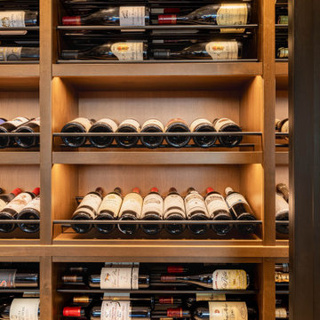 Modern Bronze Steel Wine Wall and Liquor Display in Luxury Custom Home Basement