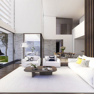Idéer för ett stort modernt allrum med öppen planlösning, med ett finrum, vita väggar, mellanmörkt trägolv och en hängande öppen spis