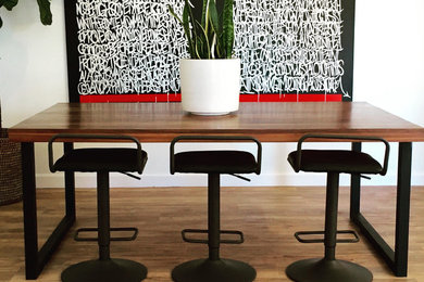 Kitchen/dining room combo - mid-sized eclectic dark wood floor kitchen/dining room combo idea in Raleigh with white walls