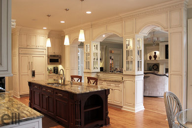 Large elegant l-shaped light wood floor eat-in kitchen photo in Charlotte with an undermount sink, beaded inset cabinets, white cabinets, granite countertops, green backsplash, mosaic tile backsplash and paneled appliances