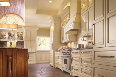 Kitchen - large kitchen idea in Other with raised-panel cabinets, white cabinets, granite countertops, beige backsplash, subway tile backsplash, stainless steel appliances and an island