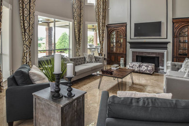 Inspiration for a modern travertine floor living room remodel in Houston with gray walls, a standard fireplace, a tile fireplace and a wall-mounted tv