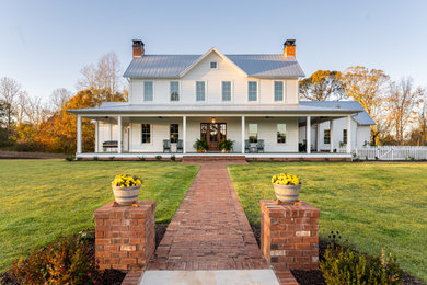 Inspiration for a country white two-story wood and clapboard exterior home remodel in Other with a metal roof and a gray roof
