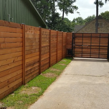 Custom Horizontal cedar fence with automatic swing gate