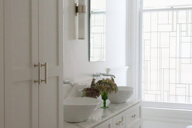 Claw-foot bathtub - mid-sized victorian master ceramic tile and white floor claw-foot bathtub idea in San Francisco with shaker cabinets, white cabinets, white walls, a vessel sink, quartzite countertops and gray countertops